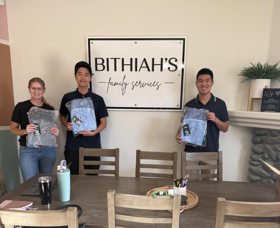 SupplySpark volunteers delivering backpacks to Bithiah's Family Services